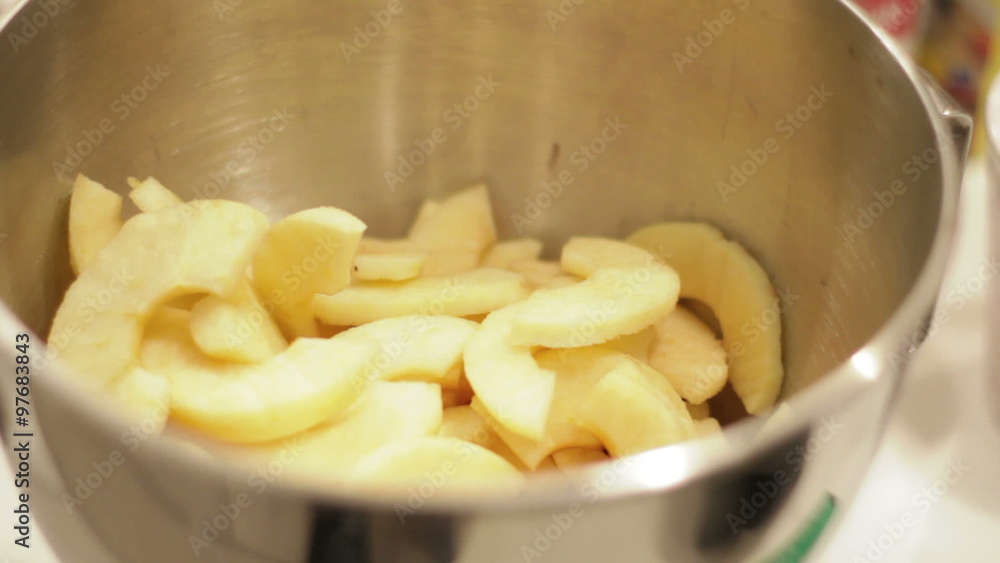 Apple slices dropping into bowl Apple slices dropping into bowl