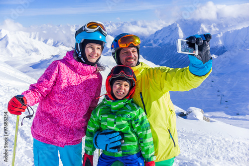 Happy family on ski 