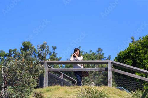 Young woman traveler smiling happy. tourist with travel in Byron Bay , NSW, Australia