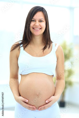 woman holds her baby bump Free Download woman holds her baby bump - GFXLoad