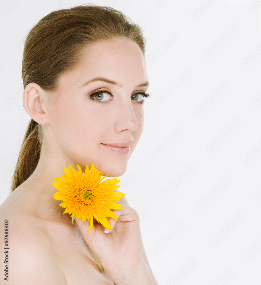 Young woman with beautiful makeup and yellow Gerbera Young woman with beautiful makeup and yellow Gerbera