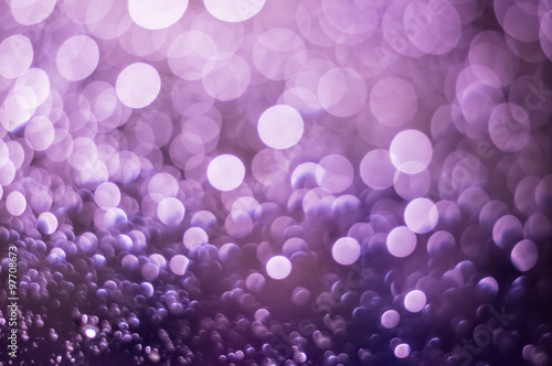Abstract blurred purple light from water drop at the windscreen bokeh background