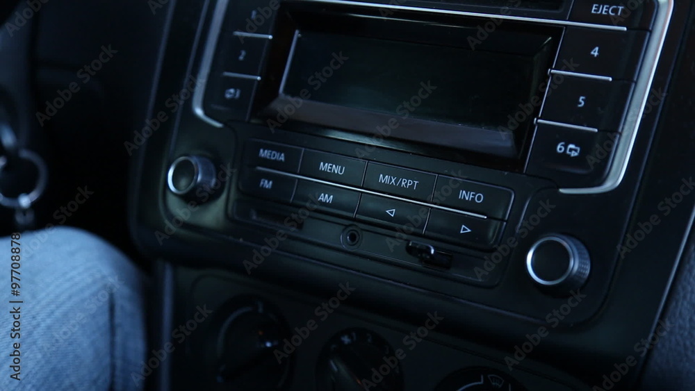 man inserts a USB flash drive