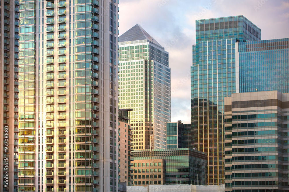 LONDON, UK - SEPTEMBER 9, 2015: Canary Wharf office buildings at sunset