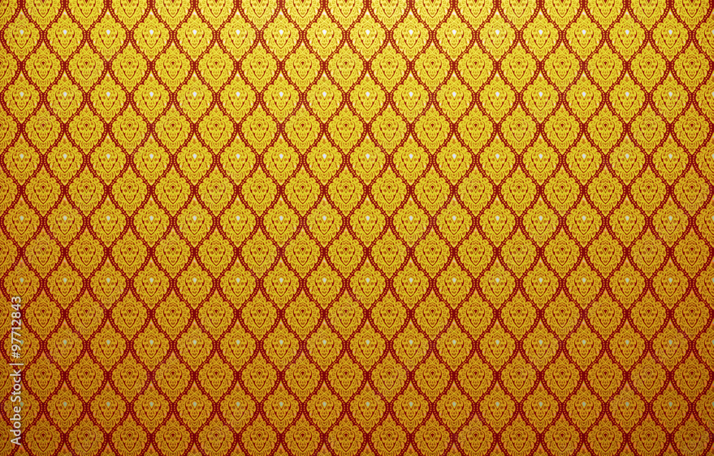 Fototapeta premium Background of Thai style fabric pattern with golden