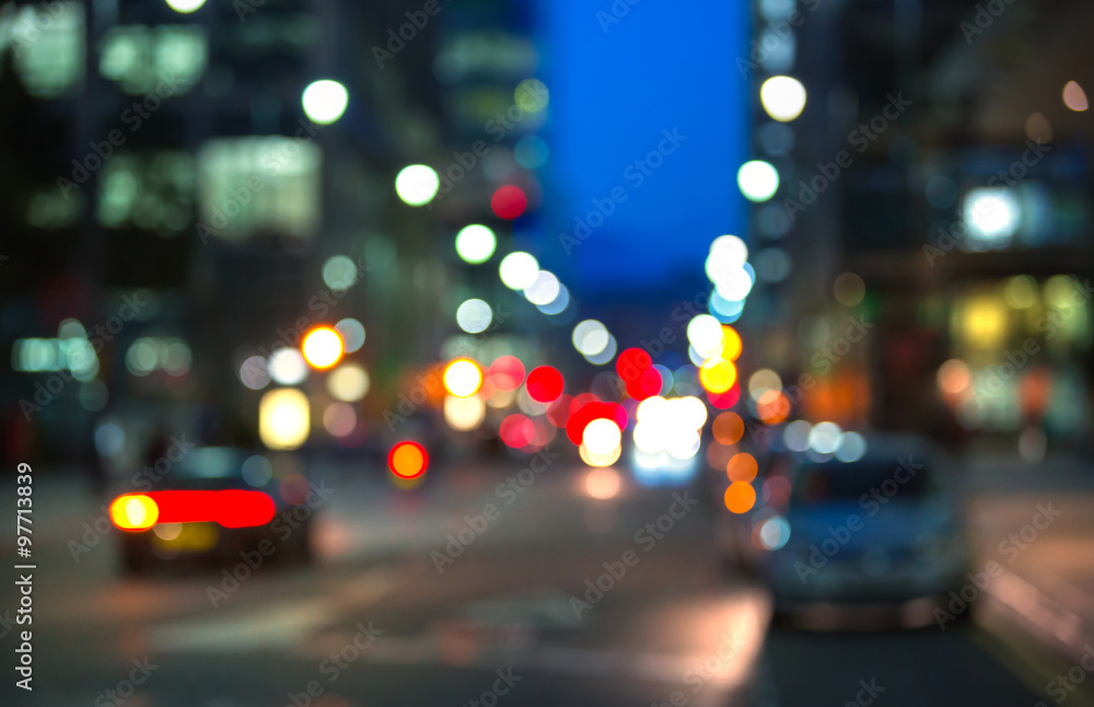 Blurred background of night city with lots of lights reflections. Template for designer's projects
