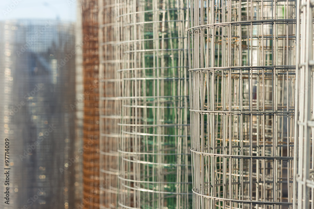 Roll of metal wire fence different colors. Selective Focus Roll of metal wire fence different colors. Selective Focus