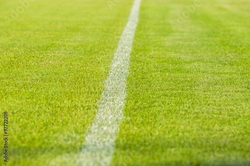 White line in middle or center of football or soccer field.