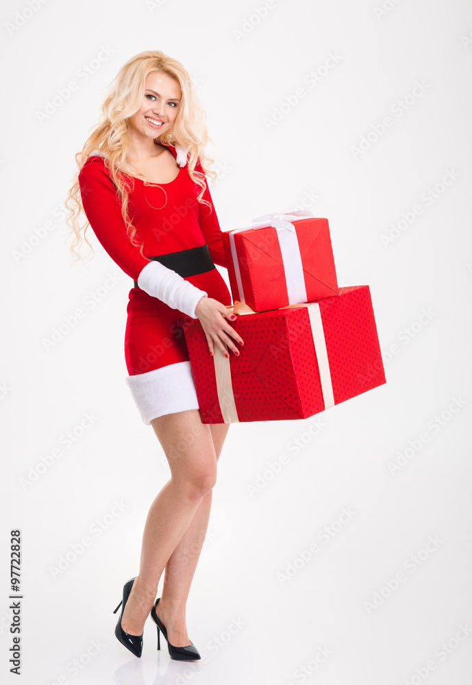 Beautiful woman in red costume of santa claus with presents Beautiful woman in red costume of santa claus with presents