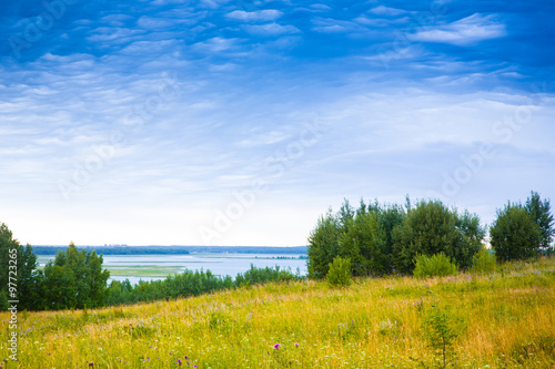 Summer view of the green meadows and lakes