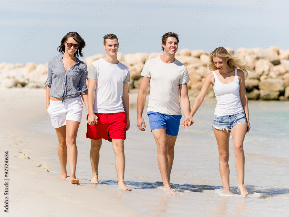 Company of young people on the beach Company of young people on the beach