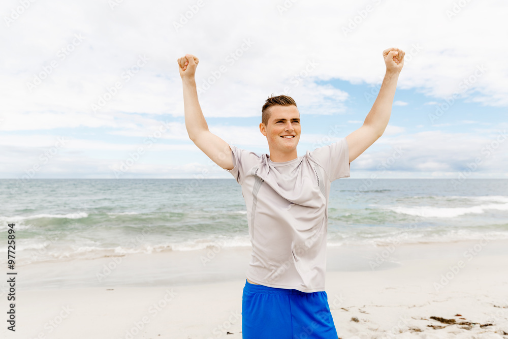 Young man in sport wear with outstretched arms Young man in sport wear with outstretched arms