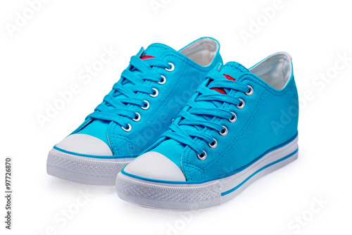 A pair of blue gumshoes with shoelace