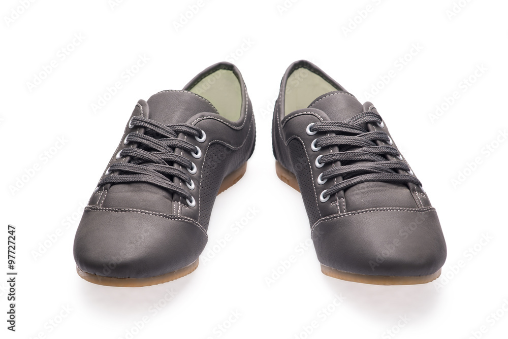 A pair of black sports shoes with shoelace