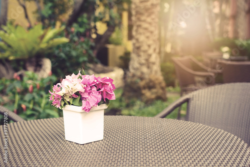 Flowers bouquet on wooden table with soft light