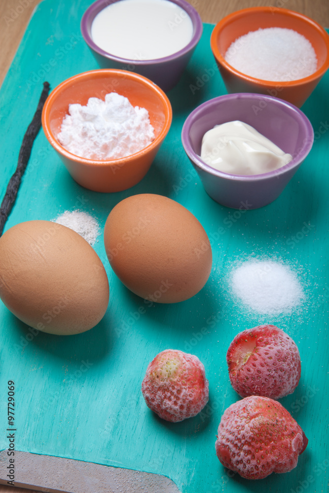 Ingredients for sweet pastry on a blue wooden cutting board. Sel Ingredients for sweet pastry on a blue wooden cutting board. Sel