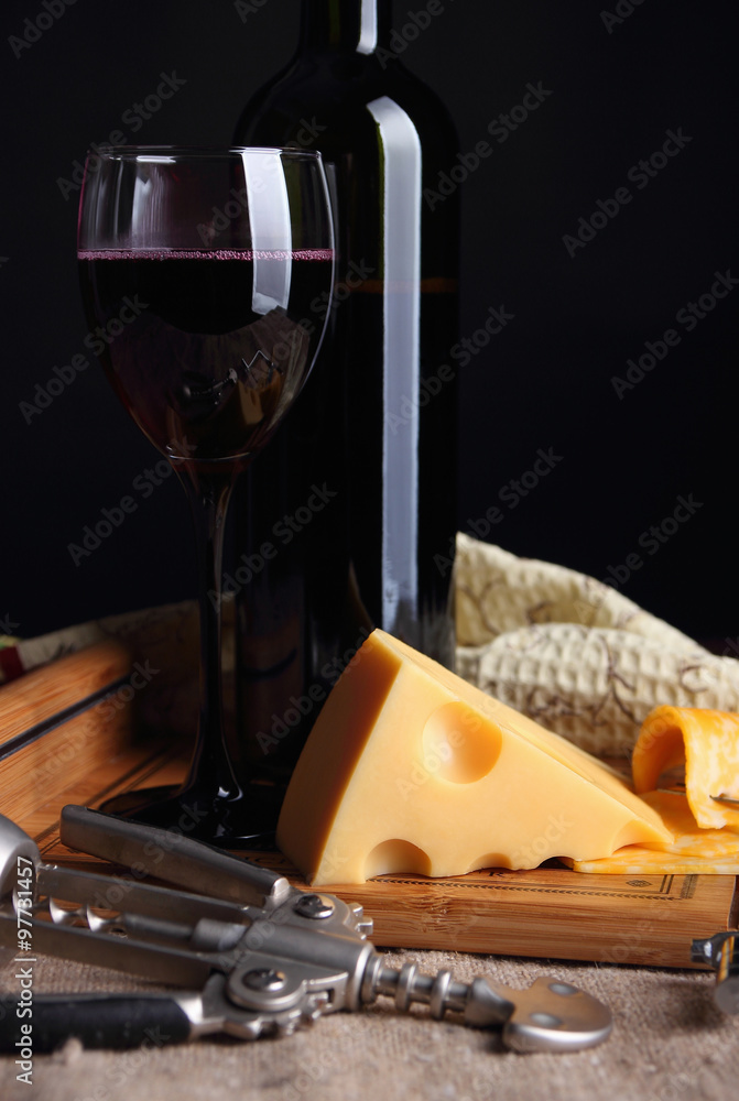 Cheese with holes and a glass of wine.. Cheese with holes and a glass of wine..