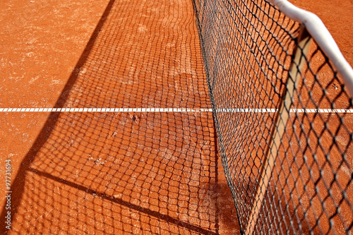 Tennis net detail on clay court © roibu