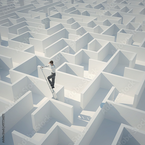 Businessman looking for the solution of the maze. Top view.