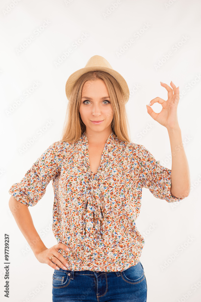 Pretty nice girl on white background shows sign Pretty nice girl on white background shows sign