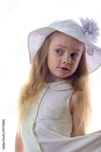 Young blonde little girl with white hat