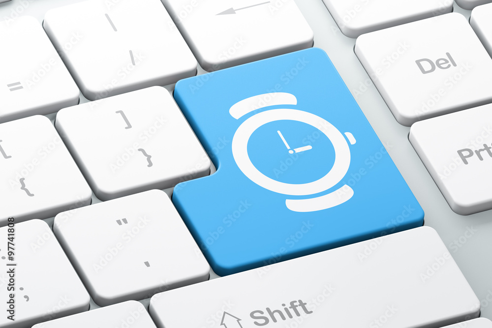 Time concept: Watch on computer keyboard background