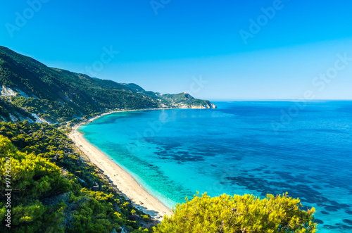 Agios Nikitas beach in Lefkada Island, Greece - Ionian Islands. In the background it is visible the village of Agios Nikitas.