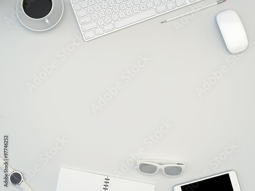 White office desk table with computer, smartphone, supplies and coffee cup. Top view with copy space