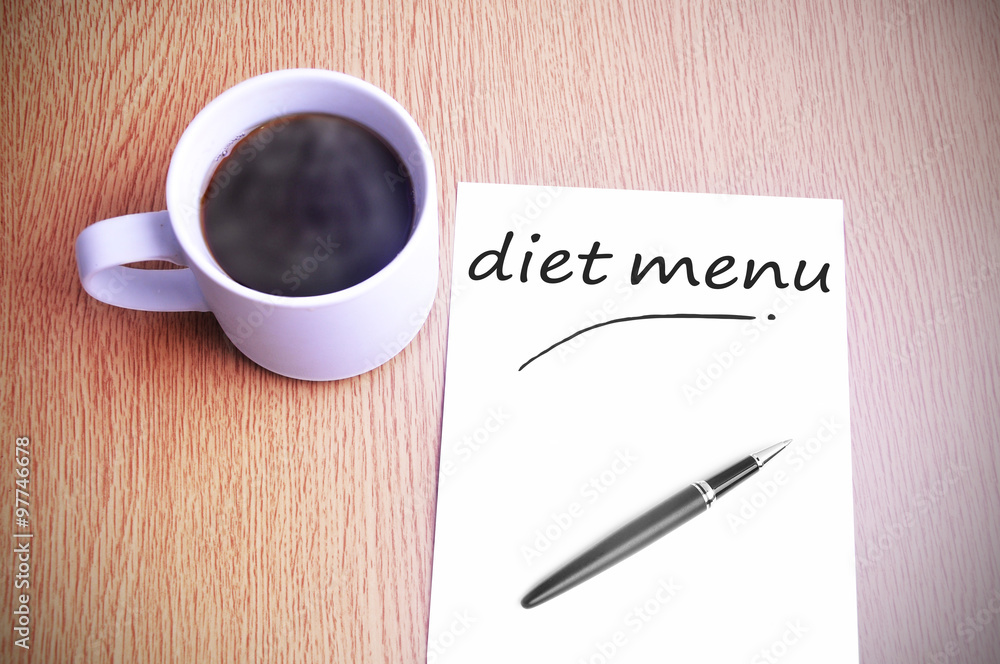 Coffee on the table with note writing diet menu Coffee on the table with note writing diet menu