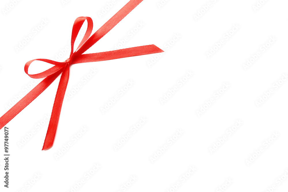 Shiny red ribbon with bow isolated on white Shiny red ribbon with bow isolated on white