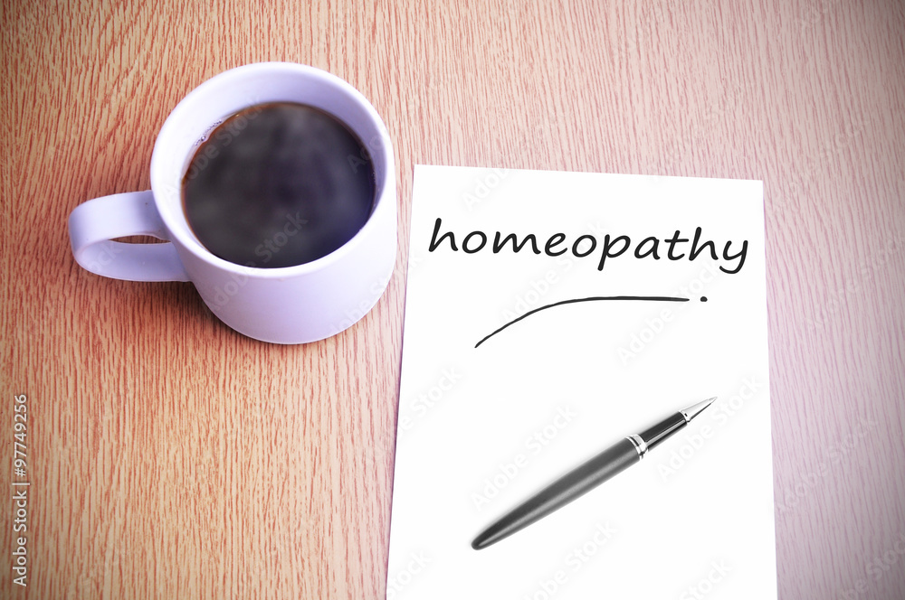 Coffee on the table with note writing homeopathy Coffee on the table with note writing homeopathy