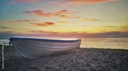 Beautiful sunrise and fishing boat