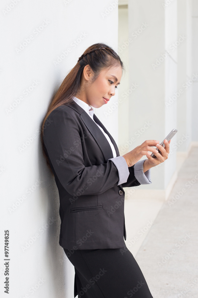 Business woman holding cellphone. checking email text messaging Business woman holding cellphone. checking email text messaging