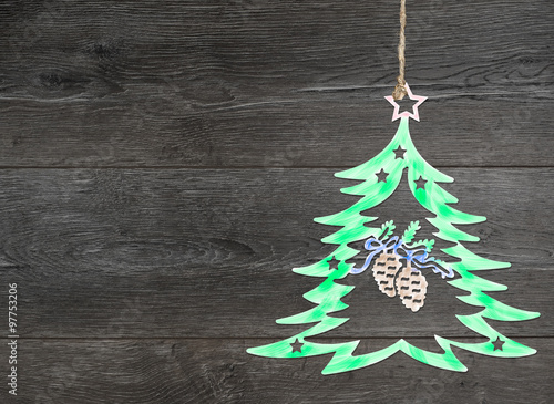 Homemade christmas tree decoration on a wooden background.