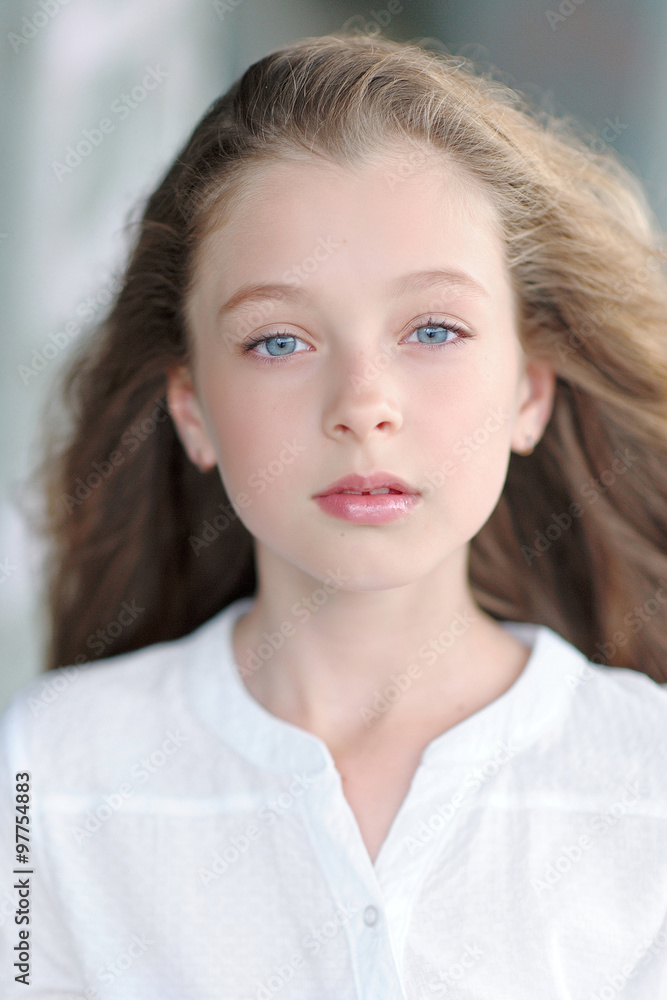 Fototapeta premium portrait of little girl outdoors in summer