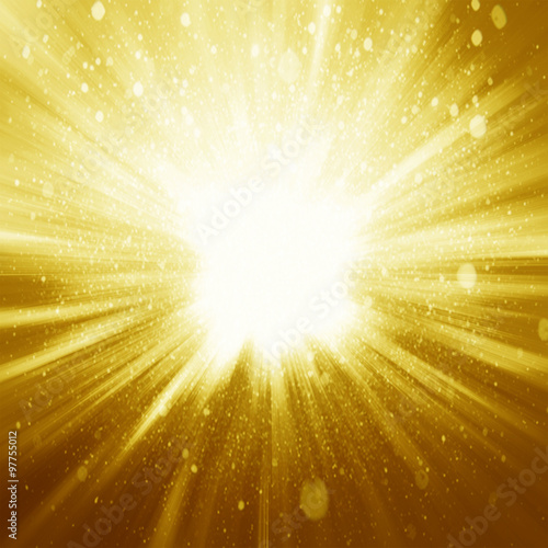 Golden sparkling background with intense glowing sparkles and gl photo