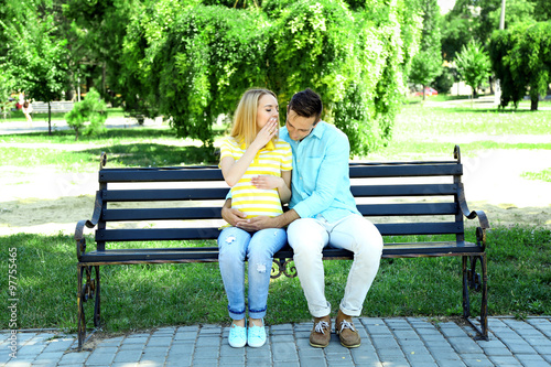 Young pregnant woman with h...