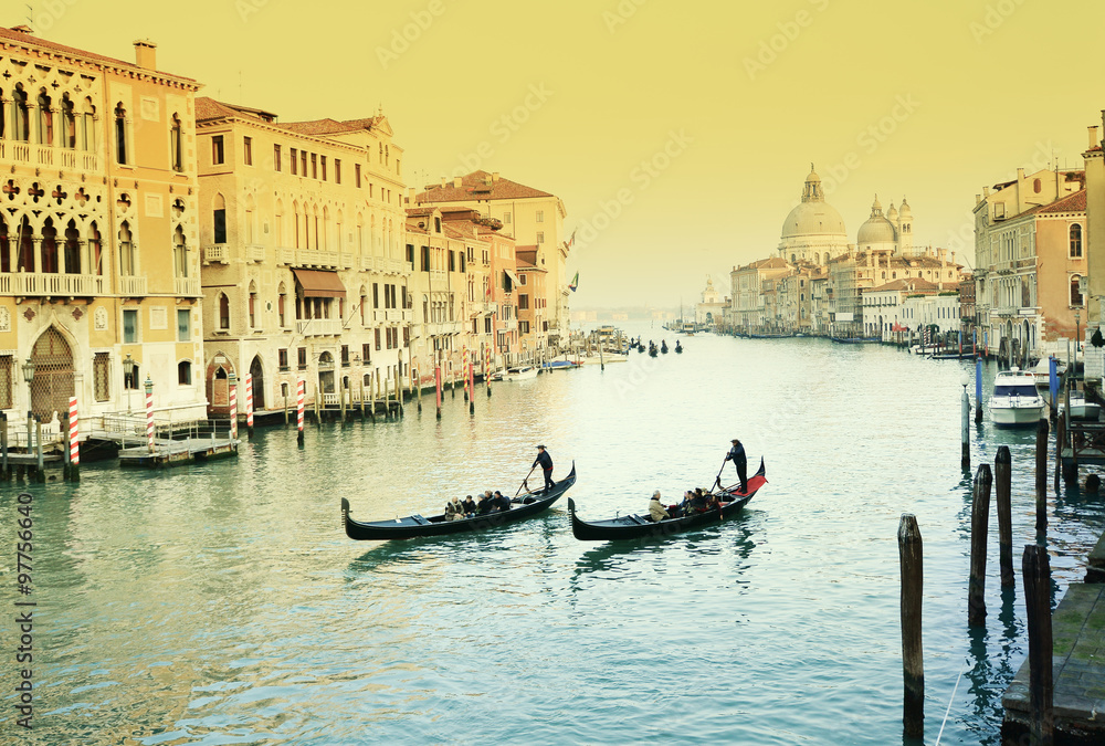 Retro image with traditional gondola on grand canal, Venice, Italy