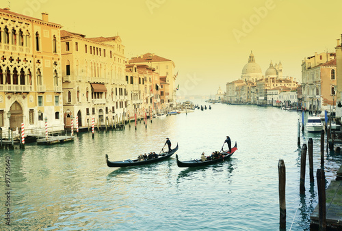 Retro image with traditional gondola on grand canal, Venice, Italy