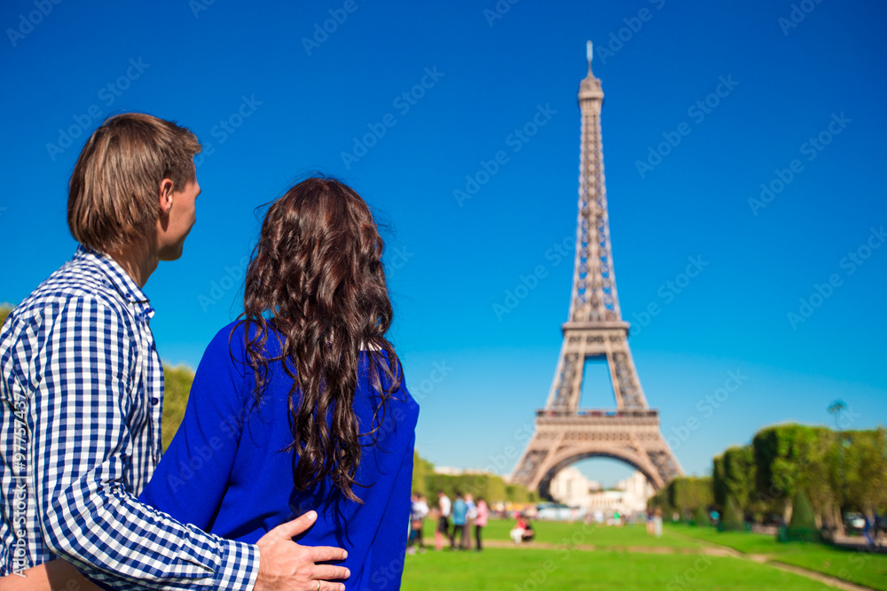 Family vacation on the Champ de Mars in Paris background the Eiffel Tower