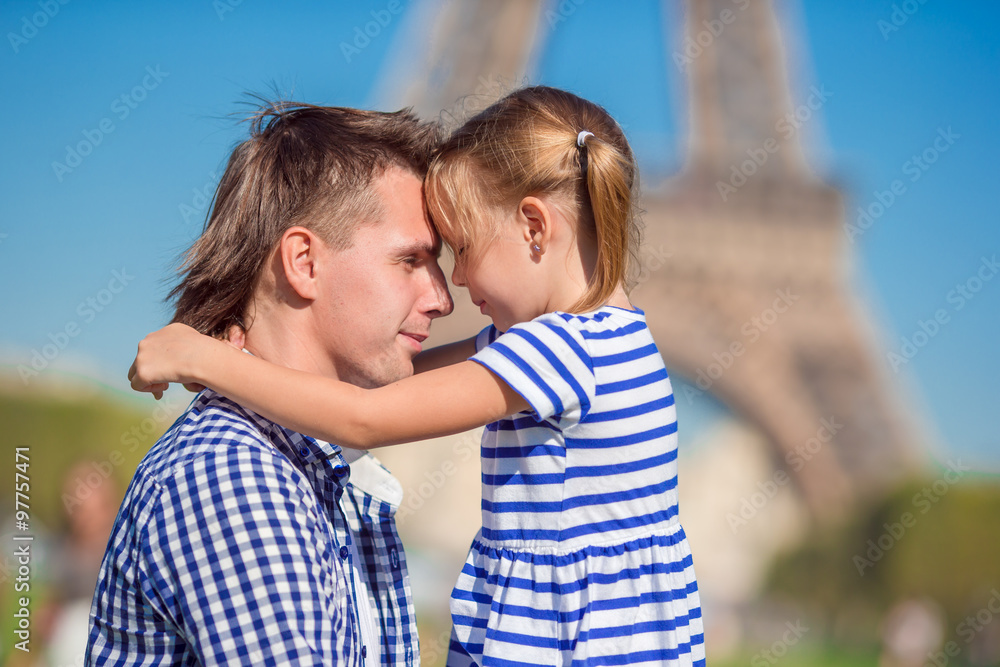 Happy family near Eiffel Tower in Paris, France Happy family near Eiffel Tower in Paris, France
