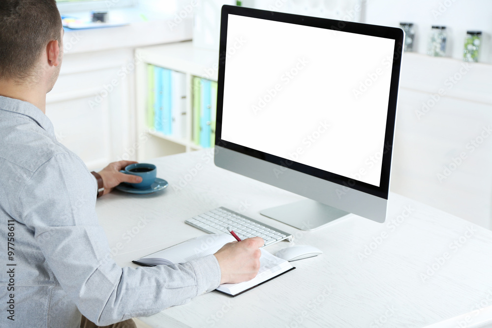Man working with computer in office Man working with computer in office