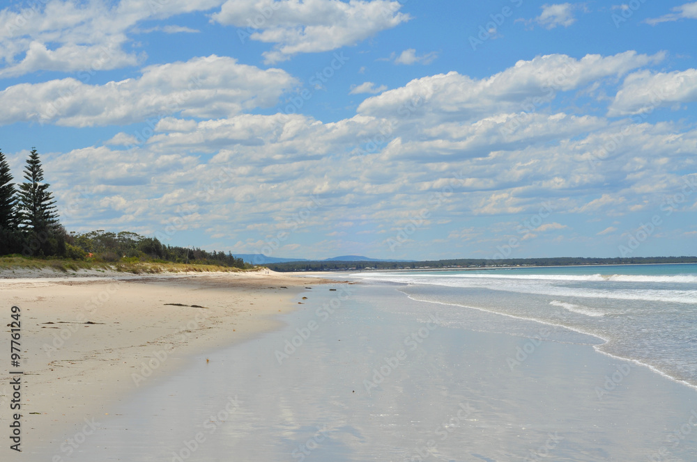 A long white sand beach in New South Wales.