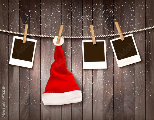 Holiday Christmas background with photos and a Santa hat. Vector