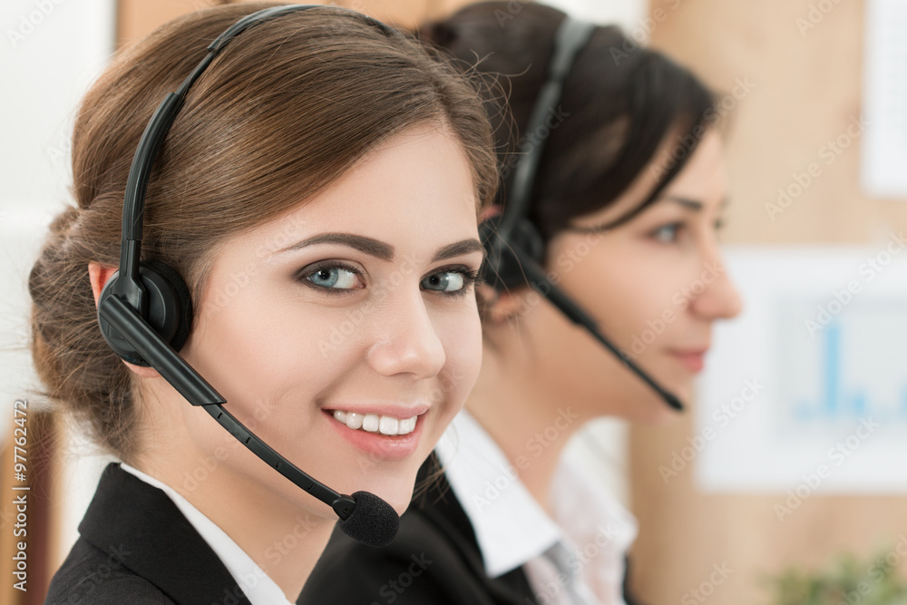 Portrait of call center worker accompanied by her team Portrait of call center worker accompanied by her team