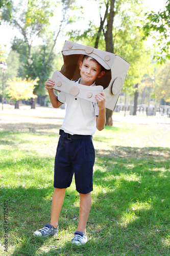 Funny boy in carton helmet ...