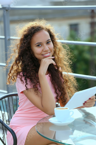 Smiling young woman enjoyin...