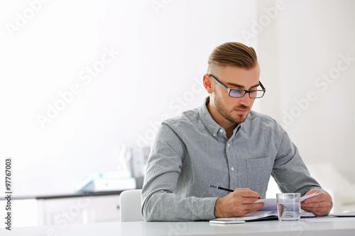 Businessman working with la...