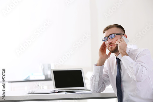 Businessman working with la...