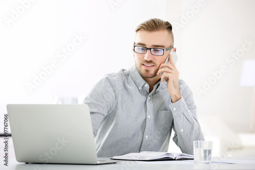 Businessman working with la...